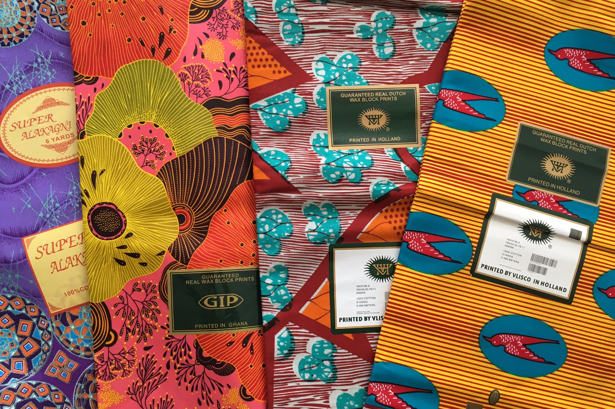 Load video: Video showing how to remove sticky manufacturer&#39;s labels from ankara fabric